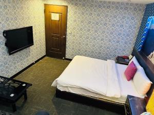 Μια τηλεόραση ή/και κέντρο ψυχαγωγίας στο Wecity Hotel 薇城精緻旅店