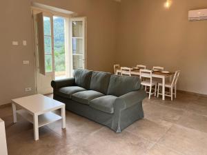 a living room with a couch and a table at Il colle in Lucca