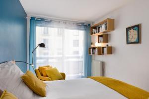 Posteľ alebo postele v izbe v ubytovaní Central Montparnasse / Voyage d'affaire / Découverte de la ville
