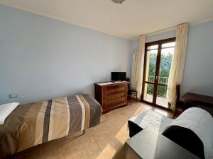 Postel nebo postele na pokoji v ubytování R&B Del Monte
