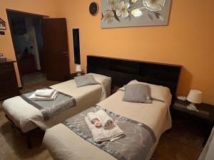 Postel nebo postele na pokoji v ubytování A casa di Lou