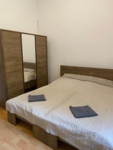 Postel nebo postele na pokoji v ubytování Palóc Panzió