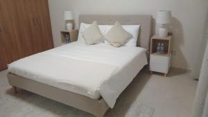 Postel nebo postele na pokoji v ubytování P one Hotel apartment