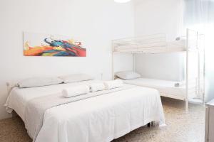 Posteľ alebo postele v izbe v ubytovaní Enjoy Apartment Gorla