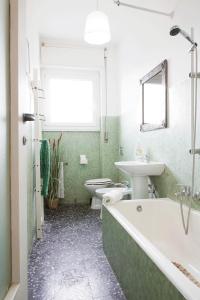 Kúpeľňa v ubytovaní Enjoy Apartment Gorla