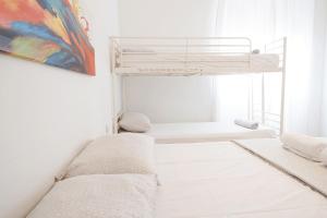 Posteľ alebo postele v izbe v ubytovaní Enjoy Apartment Gorla