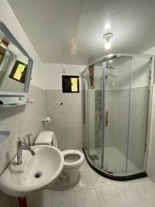 a bathroom with a shower and a toilet and a sink at Farm House in Corella-Bohol in Corella +20 photos