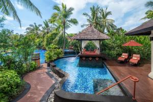 a pool at a resort with a gazebo at The St. Regis Bali Resort in Nusa Dua
