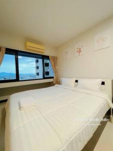 Ένα ή περισσότερα κρεβάτια σε δωμάτιο στο 2BR Charming Family Suite