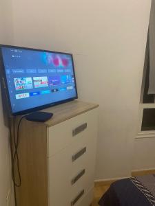 a flat screen tv sitting on top of a dresser at Great and cozy Room in the center of Puerto del Rosario in Puerto del Rosario