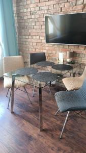 Telewizja i/lub zestaw kina domowego w obiekcie Apartamenty Mikubo Wrocław