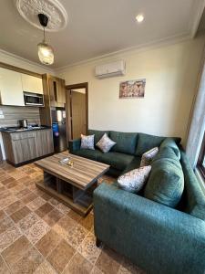 a living room with a couch and a table at 12 Antica jabalal-lwebdeh in Amman
