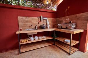 a kitchen with a counter and a sink in it at Chez Nounou in Diego Suarez