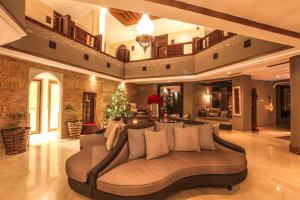 a large living room with a couch and a christmas tree at Hivernage Hotel & Spa in Marrakesh