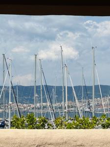 a bunch of sailboats are docked in a harbor at Apartment Gabriella in Muggia