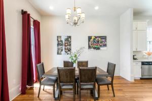 a dining room with a table and chairs at Private 3BR on Carondelet by Hosteeva in New Orleans