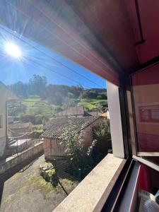 a view from a train window of a village at La casina de la Texa in La Sestal