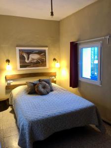 a bedroom with a bed with a pillow on it at Sweet Water Caminito del Rey in Carratraca