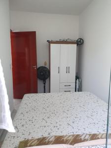 Ένα ή περισσότερα κρεβάτια σε δωμάτιο στο Quarto & Conforto