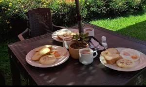 a table with two plates of food on it at Cabañas Alpina in San Agustín +32 photos
