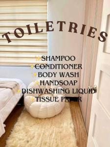 a bedroom with a door with the word toilets on the wall at Balay Bahandi Condominiums in Davao City +6 photos