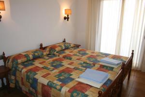 Postel nebo postele na pokoji v ubytování Apartaments Les Dunes