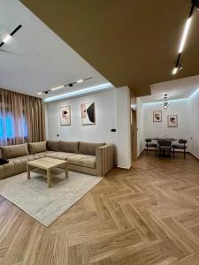 a living room with a couch and a table at Centrico 8 Tanger Bendiban in Tangier +13 photos