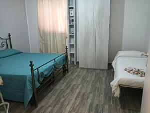 Postel nebo postele na pokoji v ubytování La casetta del maggiore