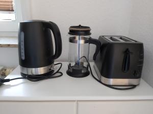 a coffee maker and a blender on a counter at Apartment in Delitzsch