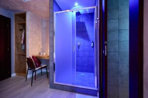 a bathroom with a shower with a glass door at Mamaco Foggia Fiera in Foggia