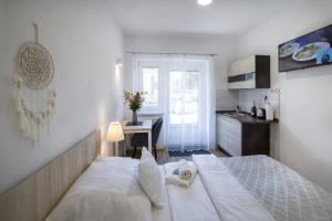 Postel nebo postele na pokoji v ubytování Apartmány U Betléma