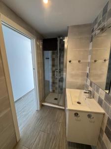 a bathroom with a sink and a shower at Penthouse Giner Benidorm centro playa by TRG in Benidorm +11 photos