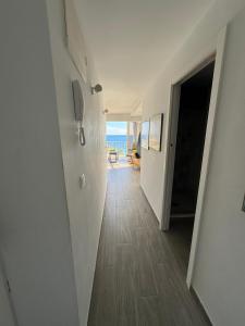 a hallway leading to a room with a view of the ocean at Penthouse Giner Benidorm centro playa by TRG in Benidorm