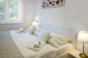 Postel nebo postele na pokoji v ubytování Apartmány U Betléma