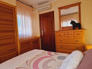 Katil atau katil-katil dalam bilik di Chalet Playa Chilches