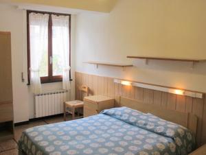 Tempat tidur dalam kamar di Residence Olivotti