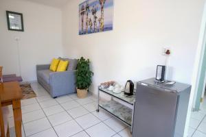 a living room with a couch and a table at St Lucia Heights in St Lucia