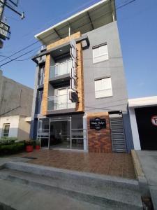 a building with a sign on the front of it at Villalba Boutique Hotel in Valledupar +56 photos