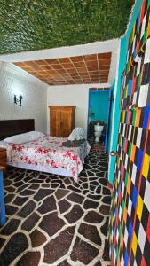 Postel nebo postele na pokoji v ubytování Eco Hotel Uxlabil Atitlan