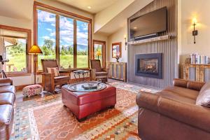 a living room with a couch and a fireplace at Mountain Sanctuary in Livingston