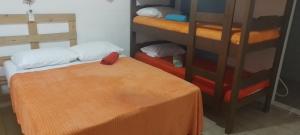 Postel nebo postele na pokoji v ubytování Pousada Boneca de Pano