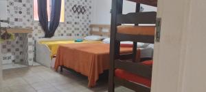 Postel nebo postele na pokoji v ubytování Pousada Boneca de Pano