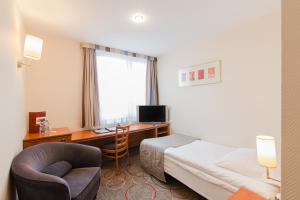 Telewizja i/lub zestaw kina domowego w obiekcie Qubus Hotel Głogów