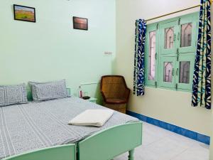 Katil atau katil-katil dalam bilik di Hotel tulsi palace