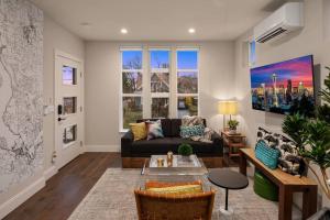 a living room with a couch and a table at New House in peaceful and trendy Central District in Seattle