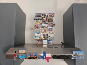 a table with two speakers and pictures on it at Mau Beach House in Lido di Ostia