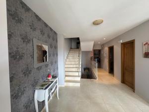 a hallway with a staircase in a house at La Casa de Juan in Jarandilla de la Vera