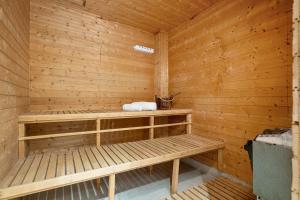 a wooden sauna with a bench in it at Arctic Aurora Apartment I SAUNA I Family & Groups in Tromsø