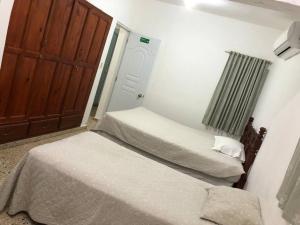 Postel nebo postele na pokoji v ubytování Villa Cordero - Las calderas baní + 16 fotografií
