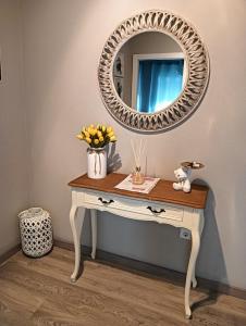 a dressing table with a mirror on top of it at House da Didy in São João da Pesqueira
